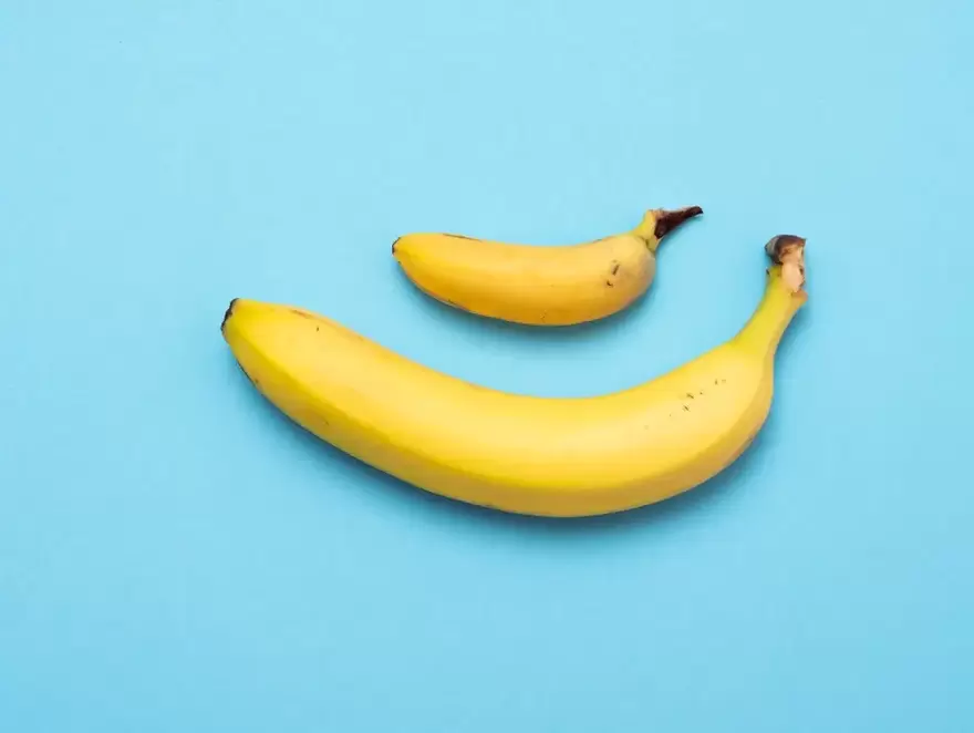 small and enlarged penis with pump on the example of bananas